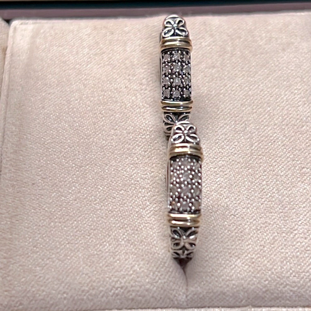 Sparkle in these Sterling Silver & Diamond Hoop Earrings with 14k Gold accents.